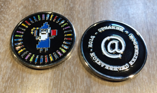 Front and back of challenge coin for speakers